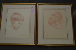 Head study of a boy and a girl, sanguine chalk, a pair.