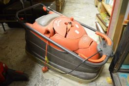 An electric Flymo lawnmower.