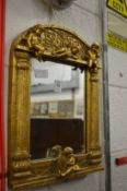 A decorative gilt framed mirror.