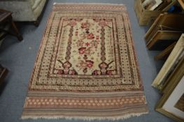 A Persian design cream ground rug 190cm x 125cm.