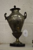 A pewter small urn.