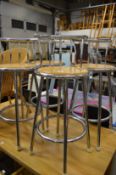 A set of four bar stools.