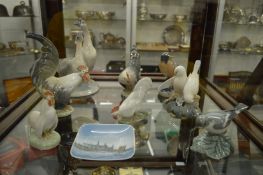 A collection of Copenhagen porcelain birds and other items to include chickens and geese.