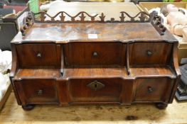 An early walnut table top chest with three small drawers over one long draw.