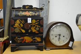 Japanese lacquer table top cabinet and a mantel clock.