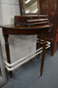 A mahogany demi-lune sidetable.