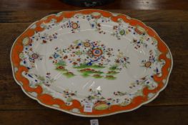 A large floral decorated meat dish.