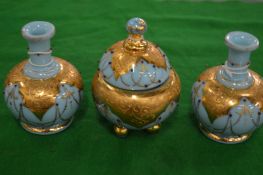 Gilt decorated pale blue opaque bowl and cover with pair of matching bulbous shaped vases.