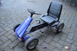 A children's pedal car.