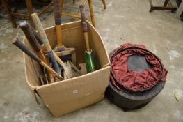 Old tennis racquets, a lantern and a circular hat box.