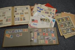 Two albums containing world stamps together with various sheets and loose etc.
