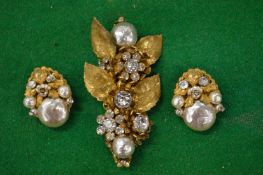 Decorative designer earrings and brooch signed Haskell.