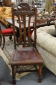 A pair of oak high back dining chairs.