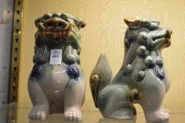 A pair of Chinese pottery dogs.