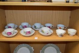 Continental porcelain floral decorated cups and saucers.