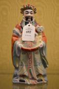 A Chinese figure of an emperor.