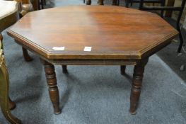 An octagonal shaped coffee table.