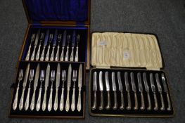 A set of twelve silver handled fruit knives, cased together with a set of twelve cased dessert