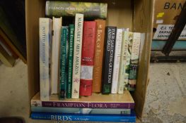 A box of gardening and other books.