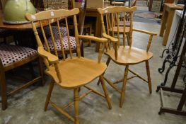 A pair of kitchen armchairs.