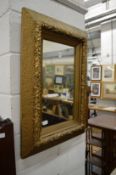 A decorative gilt framed mirror.
