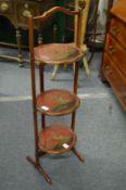A chinoiserie decorated three tier folding cake stand.