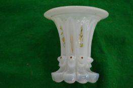 A small opaque glass vase.