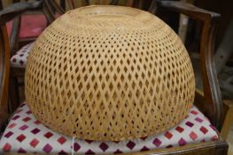 A bamboo lightshade and a venetian blind.