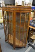 A 1930's walnut display cabinet.