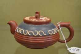 A Chinese Yixing teapot.
