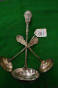 A sterling silver soup ladle and pair of matching sauce ladles.