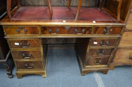 A reproduction pededstal desk.
