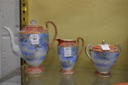A three piece Japanese tea set.