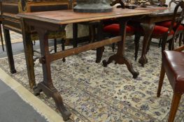 A Victorian pine stretcher table.