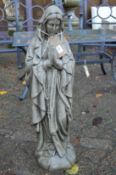 A composite garden ornament modelled as The Madonna.