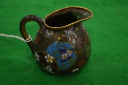 A small cloisonne jug.
