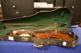 A cased violin and bow.