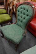 A Victorian button upholstered nursing chair.