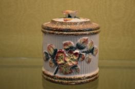 A floral decorated jar and cover.