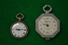A miniature silver fob watch and another fob watch.