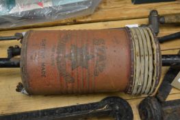 An old hand operated vacuum cleaner.