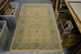 An Indian cream ground floral decorated rug 185cm x 115cm.