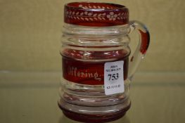 A small glass tankard.