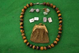 Silver cufflinks, tigers eye necklace, decorative earrings and a miniature purse.