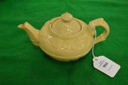 A small creamware teapot.