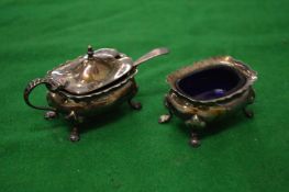 Plated mustard and salt pots.