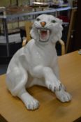 A large white glazed pottery model of a tiger.