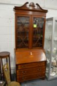 An Edwardian inlaid mahogany bureau bookcase.
