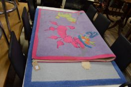 Two colourful children's rugs.