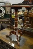 A Victorian walnut octagonal topped occasional table on carved tripod base.